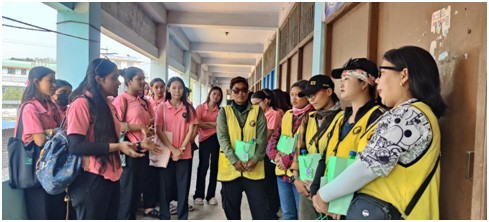 Volunteers from the NSS Cell of Pranabananda Women’s College interact with female two-wheeler taxi riders in Dimapur on March 23. (Photo Courtesy: PWC)